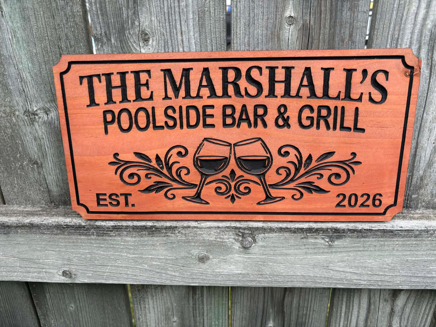 Sign with Flourishes and Wine Glasses