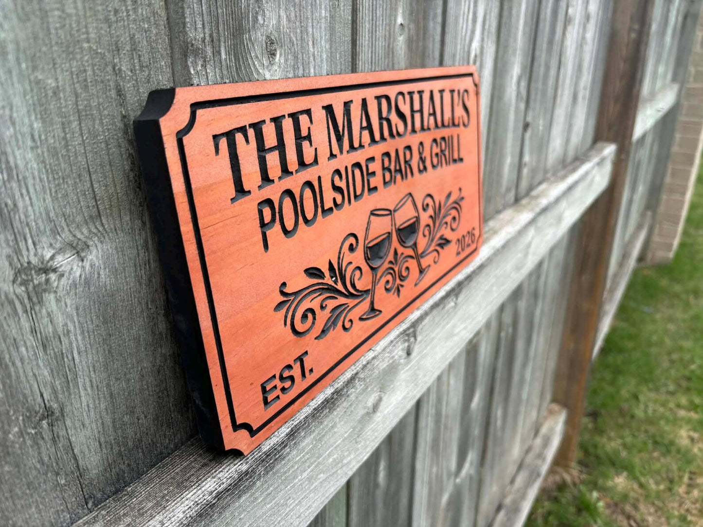 Sign with Flourishes and Wine Glasses